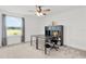 Bright office featuring a large window and a desk with bookshelves at 1940 Bell Creek Loop, Fruitland Park, FL 34731