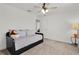 Bright bedroom featuring closet, daybed, side table, and plush carpeting at 1940 Bell Creek Loop, Fruitland Park, FL 34731