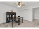 Bright office featuring a large desk, ample storage and natural light at 1940 Bell Creek Loop, Fruitland Park, FL 34731