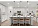 Bright kitchen featuring a large island with seating and modern pendant lighting at 1940 Bell Creek Loop, Fruitland Park, FL 34731