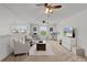 Upstairs living area features a comfortable seating area and tv for relaxing at 1940 Bell Creek Loop, Fruitland Park, FL 34731