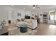 Bright living room with ample seating, tiled floors, and a comfortable, inviting layout at 1940 Bell Creek Loop, Fruitland Park, FL 34731