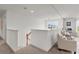 Comfortable loft area featuring plush seating, lots of light, and neutral decor at 1940 Bell Creek Loop, Fruitland Park, FL 34731