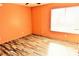 Bedroom with new floors, neutral paint, a large window, and ceiling fan at 2117 Lyme Bay Dr # 604, Orlando, FL 32839