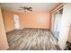 A living room featuring new floors, a ceiling fan, and sliding glass doors at 2117 Lyme Bay Dr # 604, Orlando, FL 32839