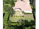 An aerial shot displaying the backyard, complemented by manicured hedges and lush landscaping at 2408 Dahlgren Way, Winter Garden, FL 34787