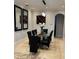 Dining room featuring a tile floor, contemporary lighting fixture, and decorative mirrors at 2408 Dahlgren Way, Winter Garden, FL 34787