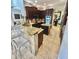 Spacious kitchen featuring dark wood cabinets, granite countertops, and stainless steel appliances at 2408 Dahlgren Way, Winter Garden, FL 34787