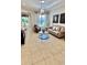 Bright living room featuring tiled floors, recessed lighting, stylish decor, and a comfortable sofa at 2408 Dahlgren Way, Winter Garden, FL 34787