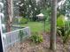 Well-maintained backyard featuring lush greenery, a charming tent, and plenty of space at 2408 Lemon Tree Ln # C, Orlando, FL 32839