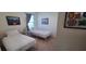 Bedroom with twin beds, neutral walls, carpet, and framed artwork at 2688 Magnolia Ave, Davenport, FL 33837