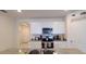 Modern kitchen showcasing white cabinets, stainless steel appliances, and granite countertops at 2688 Magnolia Ave, Davenport, FL 33837