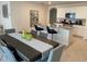 Stylish kitchen featuring granite countertops, stainless steel appliances, and ample seating at 2688 Magnolia Ave, Davenport, FL 33837
