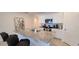 Modern kitchen with granite countertops, white cabinets, and stainless steel appliances at 2688 Magnolia Ave, Davenport, FL 33837