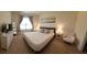 Spacious bedroom featuring a queen bed, neutral decor, and ample natural light at 2688 Magnolia Ave, Davenport, FL 33837