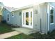Side exterior of a cozy home with an inviting backyard and French doors at 3426 Somerset Ave, Deltona, FL 32738