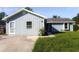 Charming home featuring light blue siding, well-manicured lawn, and a welcoming front entrance at 3426 Somerset Ave, Deltona, FL 32738