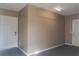 Spacious garage with neutral walls and two doors at 3426 Somerset Ave, Deltona, FL 32738