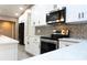 Modern kitchen features white cabinets, stainless steel appliances, and a stylish backsplash at 3426 Somerset Ave, Deltona, FL 32738