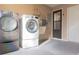 Bright laundry area with modern LG washer and dryer appliances and a utility sink at 3426 Somerset Ave, Deltona, FL 32738