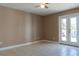 Bright living room with tile flooring and glass doors to the outside at 3426 Somerset Ave, Deltona, FL 32738
