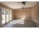 Spacious living room with French doors providing plenty of natural light at 3426 Somerset Ave, Deltona, FL 32738