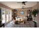 Bright living room with modern decor, neutral color palette, and a view of the backyard at 3426 Somerset Ave, Deltona, FL 32738