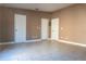 Neutral living room with tiled floors and multiple doors at 3426 Somerset Ave, Deltona, FL 32738