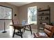 Home office with large window, stylish desk, and modern shelving unit at 3426 Somerset Ave, Deltona, FL 32738