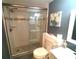 Bathroom featuring a glass shower and white vanity at 3475 Flossmoor Ave # 103, Orlando, FL 32822