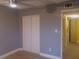 Bedroom featuring wood-look flooring and a closet with sliding doors at 3475 Flossmoor Ave # 103, Orlando, FL 32822