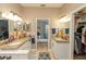 This spacious bathroom features dual sinks, and an ensuite bathroom entrance at 39342 Harbor Hills Blvd, Lady Lake, FL 32159
