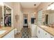The bathroom features dual sinks, granite countertops, and a separate tub at 39342 Harbor Hills Blvd, Lady Lake, FL 32159