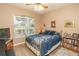 Comfortable bedroom with large window and ample natural light at 39342 Harbor Hills Blvd, Lady Lake, FL 32159