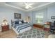 Serene bedroom with tray ceiling, blue color scheme, and ample natural light at 39342 Harbor Hills Blvd, Lady Lake, FL 32159