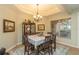 Cozy dining area featuring a table with chairs and a display cabinet at 39342 Harbor Hills Blvd, Lady Lake, FL 32159