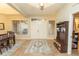 Inviting foyer with tile flooring, decorative rug, and charming entryway furniture at 39342 Harbor Hills Blvd, Lady Lake, FL 32159