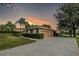 Detached two-car garage with decorative accents and a spacious driveway at 39342 Harbor Hills Blvd, Lady Lake, FL 32159