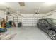 Two car garage featuring plenty of storage, overhead door and space for parking at 39342 Harbor Hills Blvd, Lady Lake, FL 32159