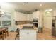 Bright kitchen equipped with granite countertops, stainless steel appliances, and a cozy breakfast nook at 39342 Harbor Hills Blvd, Lady Lake, FL 32159