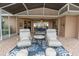Screened-in patio featuring comfortable seating, stylish décor, and a relaxing atmosphere at 39342 Harbor Hills Blvd, Lady Lake, FL 32159