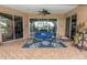 Screened-in patio featuring a swing, stylish decor, and access to the home at 39342 Harbor Hills Blvd, Lady Lake, FL 32159