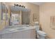 Bathroom featuring vanity, mirror, and walk-in shower at 424 Valverda Dr, The Villages, FL 32162