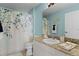 Cozy bathroom featuring a decorative shower curtain, vanity, and neutral finishes at 424 Valverda Dr, The Villages, FL 32162