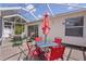 Screened patio with covered area and outdoor seating at 424 Valverda Dr, The Villages, FL 32162