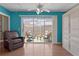Cozy sunroom with access to an outdoor patio area and a built-in storage cabinet at 424 Valverda Dr, The Villages, FL 32162
