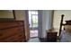 Bedroom with wood furniture and sliding doors to the patio at 4300 Aqua Vista Dr # A, Orlando, FL 32839
