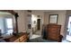 Main bedroom with wood furniture, view of the bathroom, and access to the patio at 4300 Aqua Vista Dr # A, Orlando, FL 32839