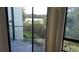 Balcony sliding glass door view overlooking natural scenery, vegetation, and water at 4302 Aqua Vista Dr # G, Orlando, FL 32839