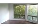 Bright bedroom featuring lots of natural light through large windows with backyard tree views at 4302 Aqua Vista Dr # G, Orlando, FL 32839